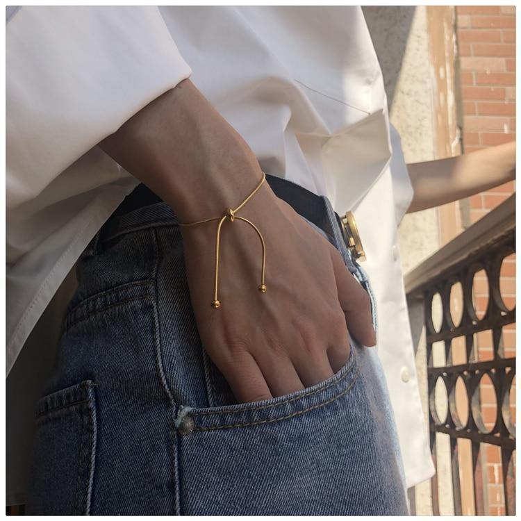 HUANZHI 2020 Simple Design Gold Color Snake Chain Bangle Pull-out Adjustable Bracelet for Women Girl Men Beads Jewelry 22cm